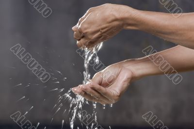 A man washing hands with water