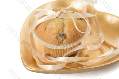 Muffin on a gold plate