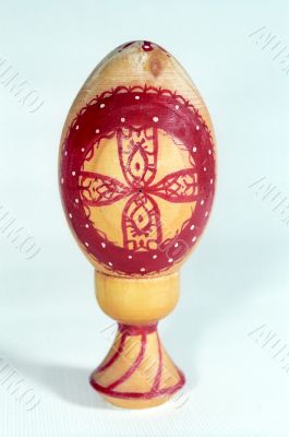Easter egg of wood with red cross