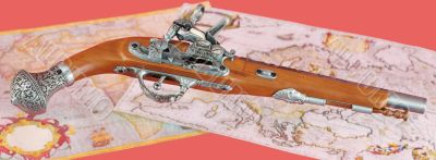 Ancient pistol on maps background