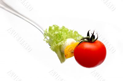 cherry tomato on fork
