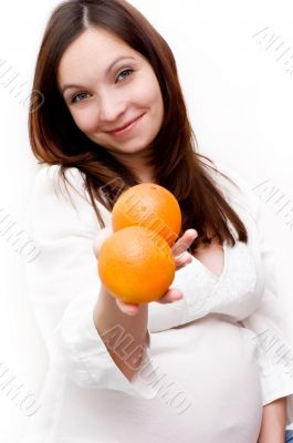 Pregnant woman and oranges
