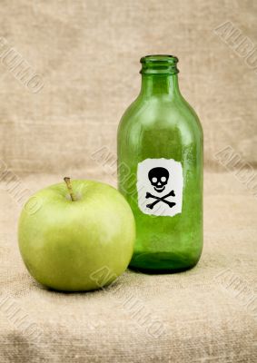 Green bottle and green apple