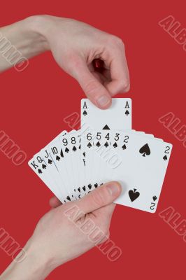 Playing cards on hands