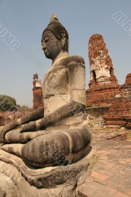Sitting Buddha in ancient ruins