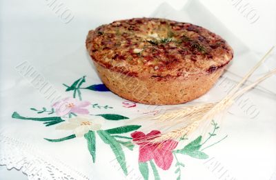 Loaf of feta cheese bread with spikes on the hand made diaper