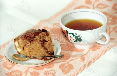 Chocolate cake with nuts and tea