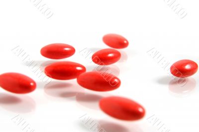 A few medicine tablets on a table