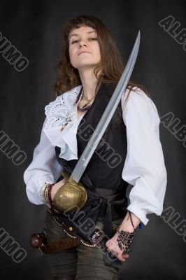 The girl - pirate with a sabre in hands