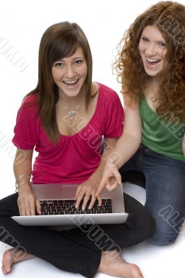 Two teenagers with laptop computer