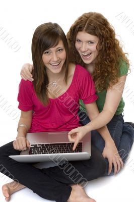 Two teenagers with laptop computer
