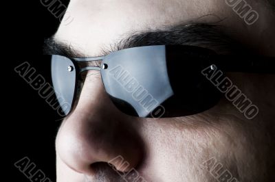 Man on sun glasses macro