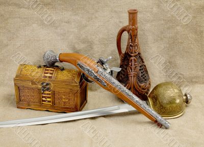 Bottle, rapier, sword, pistol and chest