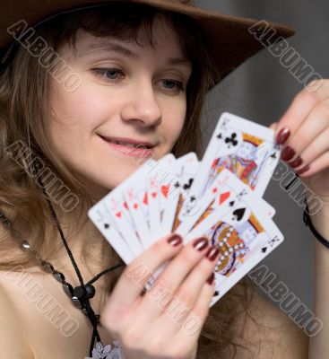 Portrait girl with a playing-cards