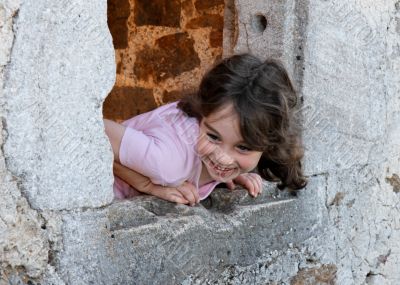 Smiling girl in the castle window