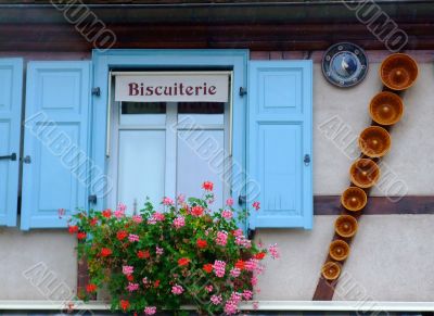 Cookies shop facade with cake tins