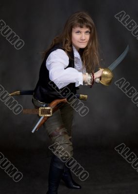 The girl - pirate with a sabre in hands