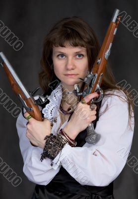 Girl - pirate with two ancient pistols in hands