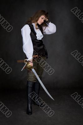 The girl - pirate with a sabre in hands