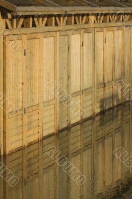 Wood wall with reflection in the water