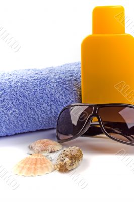 towel, sunglasses and lotion