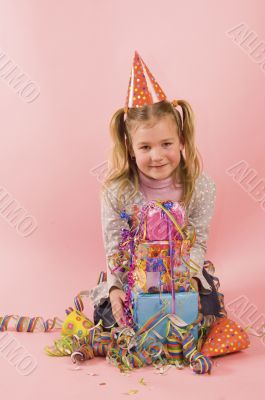 little girl in front of her present on her birtday