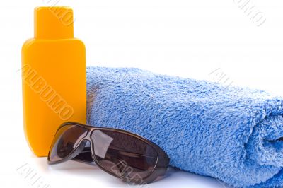 towel, sunglasses and lotion