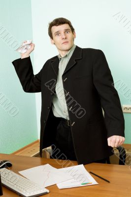 Director on a workplace with a crushed paper