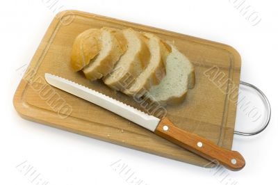 Bread, chopping board and knife