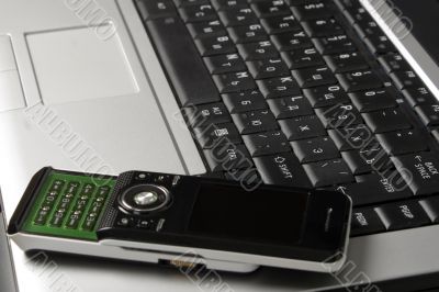 Black keyboard and mobile phone