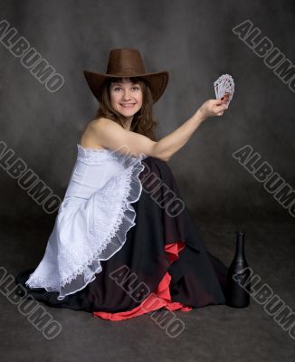 Girl with a playing-cards in hand