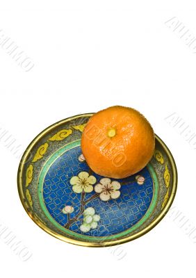 Tangerine on a plate, isolated