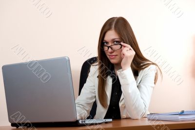 Young business woman in glasses work in office