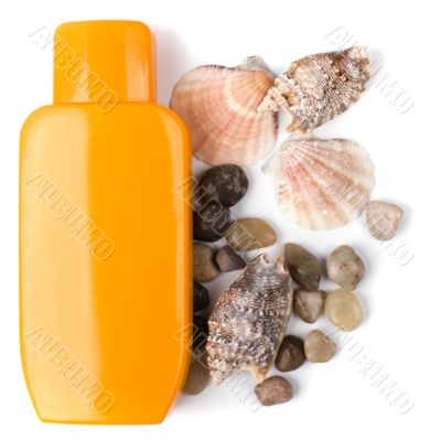 lotion and some pebble and shells