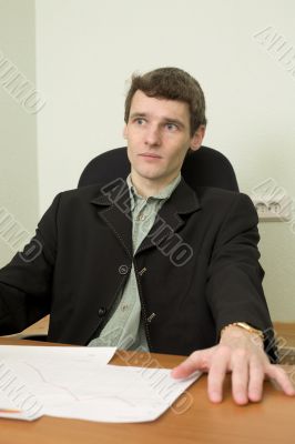Clerk at office sits at a desktop