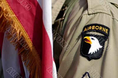 US soldier and flag of Airborne division