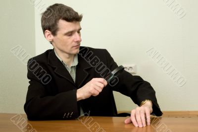 Person view a watch through a magnifier