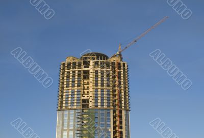 Cranes and building construction of a skyscraper early morning a