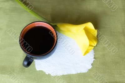 a cup of coffee and a calla