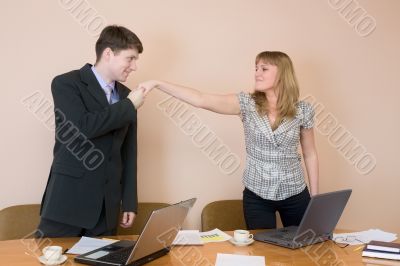 Young businessmen welcome each other