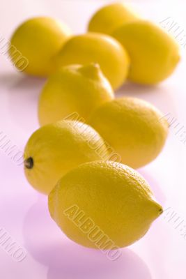 lemons on violet reflecting background