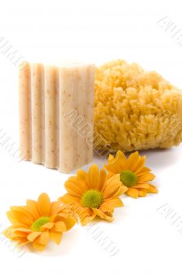 natural sponge, soap and flowers