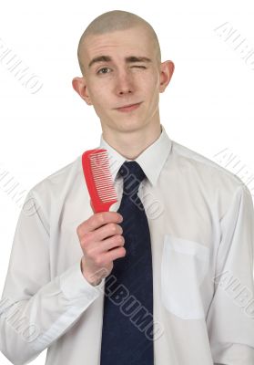 Absolutely bald guy with a hairbrush
