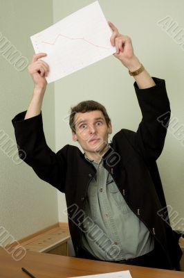 Director on a workplace with a graph