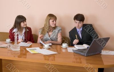 Business team sits at the table