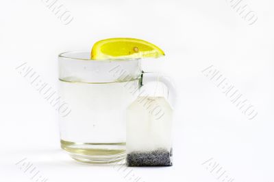 Hot water with a lemon and tea bag