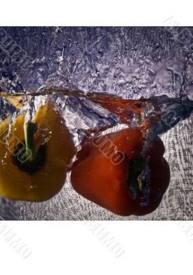 Fresh vegetables immersed in clear water.