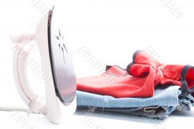 electric iron and pile of clothes