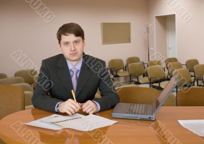 Businessman at a table with laptop