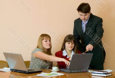 Girls at a desktop and their chief